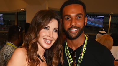 Singer Nancy Ajram and actor Lucien Laviscount at the Abu Dhabi Grand Prix at Yas Marina Circuit. Getty Images