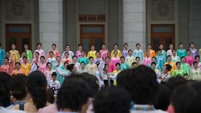 Members of the Women’s League perform at the Pyongyang grand theatre to mark the 63rd anniversary of the Korea War Aarmistice agreement. Kim Won-jin / AFP Photo