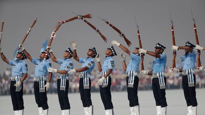 Indian Air Force (IAF) air warrior drill team members display skills on Air Force Day in Hindon, India. Tsering Topgyal / AP Photo