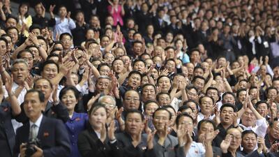 North Koreans cheer for Moon Jae-in and Kim Jong Un. Getty Images