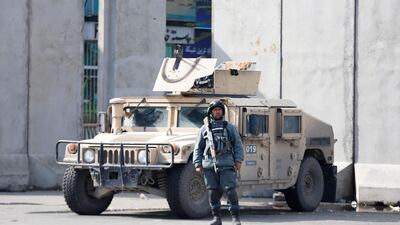 An Afghan soldier stands guard near a demonstration outside the presidential palace in Kabul. EPA