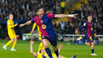 Barcelona's Robert Lewandowski celebrates after sccing the second of his two goals in a 4-0 win over Borussia Dortmund. EPA