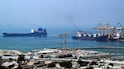 Container ships in Khor Fakkan port. Countries are seeking ways to bypass the Strait of Hormuz. AFP