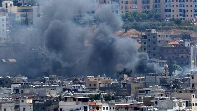 Smoke rises from buildings in Ain El Hilweh, Lebanon's largest Palestinian refugee camp, during ongoing clashes between Palestinian security forces and fighters. AFP