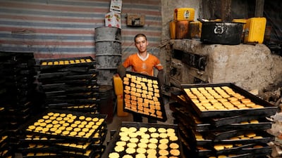 A man prepares cookies at a small traditional factory, on the first day of the holy month of Ramadan in Kabul, Afghanistan. Reuters