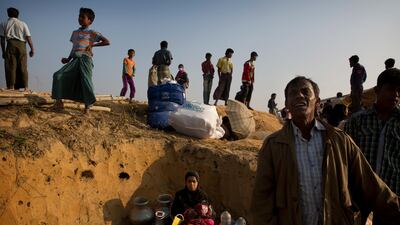A Rohingya refugee who was staying in no-man's land at Bandarban between Myanmar and Bangladesh border sits with her belongings after arriving at Balukhali refugee camp 50 kilometres from Cox's Bazar, Bangladesh on January 24, 2018. Manish Swarup / AP