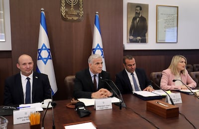 Israel's former prime minister Naftali Bennett, left, and then caretaker Prime Minister Yair Lapid, second left, attend a cabinet meeting in Jerusalem on July 3, 2022, days after legislators dissolved parliament. EPA