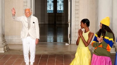 Designer Ralph Lauren waves to the audience at the close of the Ralph Lauren Spring 2023 Fashion Experience on Thursday, Oct. 13, 2022, at the Huntington Gardens in Pasadena, Calif. (AP Photo / Chris Pizzello)