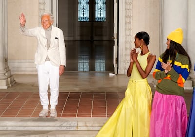 Ralph Lauren waves to the audience at the close of his brand's spring 2023 Fashion Experience. AP