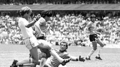 Argentina's Diego Maradona scores his second goal against England during the 1986 World Cup in Mexico AP.