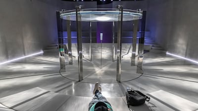 The meditation room features serene water projections.