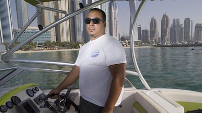 Kalid Tarapolsi, the founder of Worry Free Boat Club, with one of the club’s rental boats. Antonie Robertson / The National