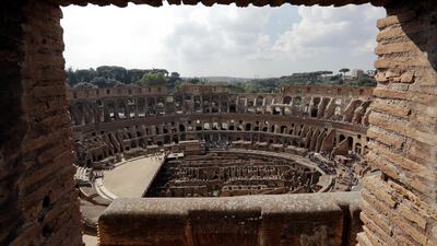 Tourists are seen visiting the ancient Colosseum as seen from a window on the occasion of a media tour presenting the re-opening after forty years of the fourth and fifth level of the Italy's most famous site, in Rome, on Tuesday, October 3, 2017. Andrew Medichini / AP Photo