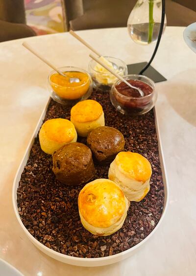 Perfectly formed scones served on a bed of cocoa nibs. Hayley Skirka / The National