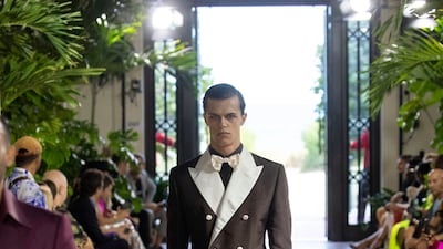 A crisply tailored 1930s-inspired suit in chocolate and cream taffeta
