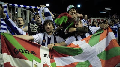 Fans display the Basque flag during a derby match between Athletic Bilbao and Real Sociedad in 2011. Alvaro Barrientos / AP Photo