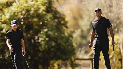 Tiger Woods and Charlie Woods walk the course during the pro-am. AFP