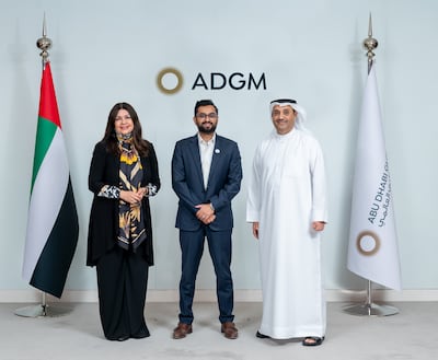 From left, Emira Socorro, head of PGIM's newly opened Abu Dhabi office, Arvind Ramamurthy, chief of market development at ADGM, and PGIM Middle East head Mohammed Abdulmalek. Photo: PGIM