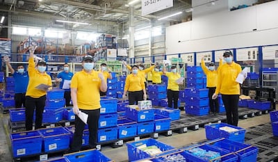 Cinema staff pack boxes at Carrefour supermarket. Courtesy Majid Al Futtaim