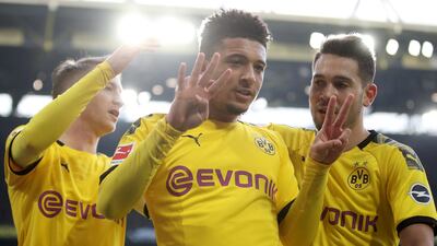 Dortmund's Jadon Sancho, centre, celebrates with teammates after opening the scoring. EPA