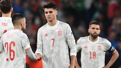 TOPSHOT - Spain's forward Alvaro Morata (C) is consoled by teammates after his miss during the UEFA EURO 2020 semi-final football match between Italy and Spain at Wembley Stadium in London on July 6, 2021. (Photo by Andy Rain / POOL / AFP)