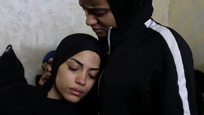 Relatives mourn the death of Palestinian teenager Mahdi Hashash, who died of shrapnel wounds during an Israeli raid. AFP