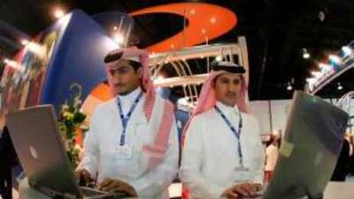 Emiratis visit the 25th edition of the Gulf information and Communication Technology Exhibition, GITEX, at the Dubai International COnvention Centre in 2005.