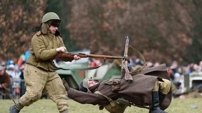 Members of a historical military club participate in the re-enactment of ‘The Battle of Poznan’ at the Citadel Park in Poznan, Poland. Jakub Kaczmarczyk / EPA