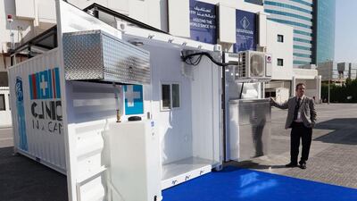 Kyle Stevens, chief engineer from Clinic in a Can demonstrates the portable containers that currently are being used in the fight against Ebola in West Africa. Anna Nielsen for the National