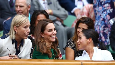 Former tennis player Martina Navratilova, Meghan, Duchess of Sussex, and Britain's Catherine, Duchess of Cambridge, in the Royal Box ahead of the final between Serena Williams of the U.S. and Romania's Simona Halep REUTERS/Hannah McKay