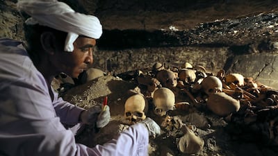 An antiquities worker is seen in the recently discovered tomb of Amenemhat, a goldsmith from the New Kingdom, at the Draa Abu-el Naga necropolis in Egypt. Mohamed Abd El Ghany / Reuters