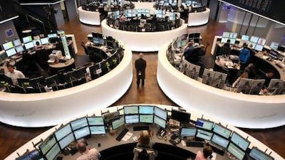 Brokers at the German stock exchange in Frankfurt on Friday, as markets rise on news of Greece's deal to cut its bond debt.