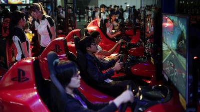 Gamers at the Tokyo Game Show last year. Eugene Hoshiko / AP