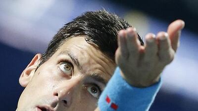 Novak Djokovic prepares to serve during his win over Vasek Pospisil on Tuesday at the Dubai Duty Free Tennis Championships. Ali Haider / EPA
