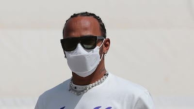 Mercedes driver Lewis Hamilton of Britain arrives at the Bahrain International Circuit ahead of practice. AP