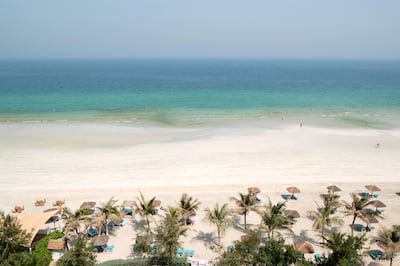 Beach and turquoise waters in Ajman. Getty Images