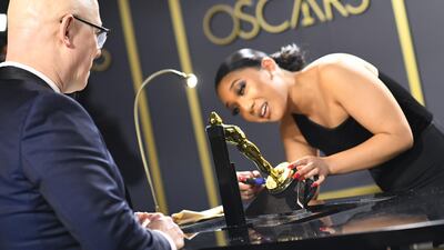 US director Steven Bognar waits as his award for Best Documentary Feature for "American Factory" is engraved at the Governors Ball after the Oscars on Sunday, February 9, 2020, at the Dolby Theatre in Los Angeles. AFP