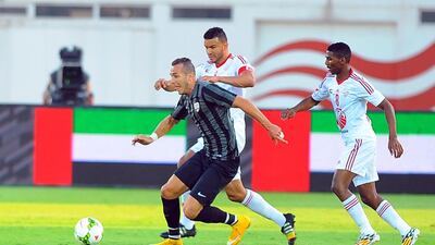Sharjah, in white, taking on Fujairah during their Arabian Gulf League match in Sharjah on December 4, 2014. Courtesy Al Ittihad