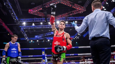 Bilal Ibrahim of the UAE celebrates beating Vadim Karabeinikov of Kazakhstan during the IFMA Muaythai World Championships at Adnec in Abu Dhabi. Victor Besa / The National