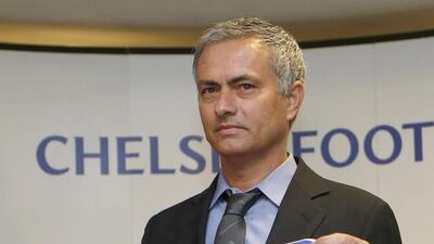Newly reappointed Chelsea manager Jose Mourinho poses for photographers during a news conference at Stamford Bridge stadium in London June 10, 2013. Suzanne Plunkett /Reuters