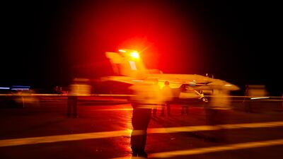 A handout photo made available by the US Navy showing a US F/A-18E Super Hornet from the 'Sidewinders' of Strike Fighter Squadron (VFA) 86 launching from the flight deck of the Nimitz-class aircraft carrier USS Abraham Lincoln (CVN 72) in the Red Sea. EPA/US NAVY