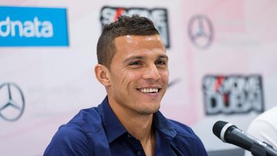 Rodrigo Lima is all smiles as he's officially presented as an Al Ahli player. Alex Atack for The National