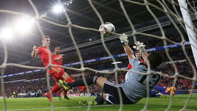 Aaron Ramsey scores the opening goal for Wales in their Euro 2016 qualifying win over Andorra on Tuesday night. Matthew Childs / Action Images / Reuters