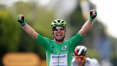 Deceuninck-Quick-Step rider Mark Cavendish celebrates as he crosses the finish line to win Stage 6 of the Tour de France.