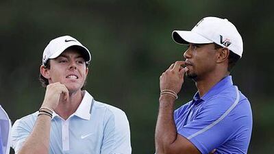 Rory McIlroy, left, also won a first World Golf Championship event in between his victories in the Open Championship and US PGA, a feat which the 25-year-old admits has taken its toll. AP Photos / Darron Cummings