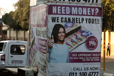 A loans company advertises its services in the Rosebank suburb of Johannesburg, AP
