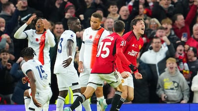 Manchester United's Victor Lindelof, right, celebrates after scoring his side's opening goal against Luton Town. AP