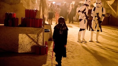 This is not the Sith Lord you are looking for ... A couple of Stormtroopers check out a suspiciously short Darth Vader at the Tatooine-style space souq at Star Wars Secret Cinema. Courtesy Camilla Greenwell