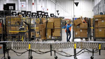 The new employees will help Amazon to meet the surge in demand from people relying on the company's services. AP