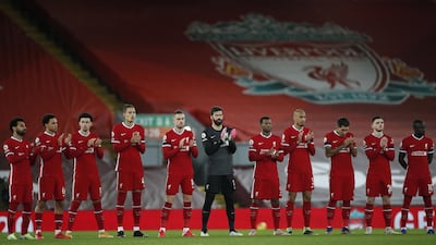 Liverpool players observe a minute applause in memory of former Liverpool manager Gerard Houllier during the English Premier League soccer match between Liverpool FC and Tottenham Hotspur in Liverpool, Britain, December 16, 2020. EPA